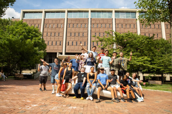 Students sitting/gathering around the Button outside of Van Pelt libray